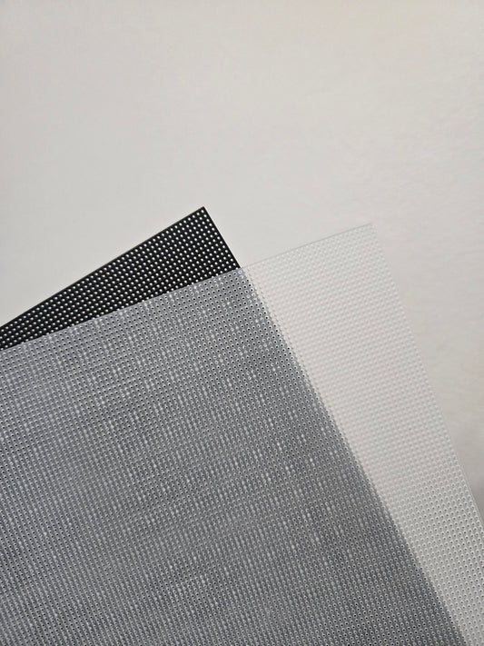 Two sheets of plastic canvas 14Ct, one black and one clear.